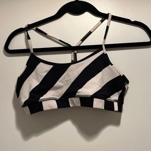 Two black and white striped lululemon flow y bras in sizes 6 and 8